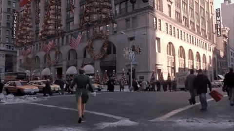 buddy the elf crossing the road and getting hit by a cab.